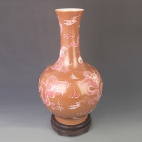 A RED COLOR GLAZED DRAGON PATTERN PORCELAIN BOTTLE