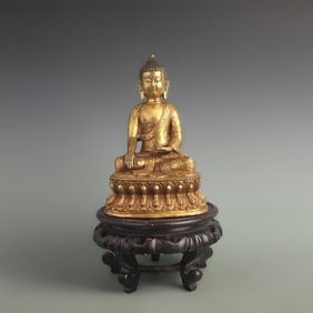 A FINE GILT BRONZE GUANGDE BUDDHA STATUE