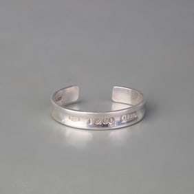 A FINE SILVER PLATED BANGLE