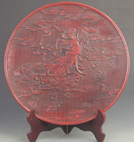 CARVED RED LACQUER PLATE WITH CELESTIAL MAIDEN SCATTERING FLOWERS DESIGN