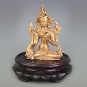 A SMALL GILT BRONZE WHITE TARA STATUE