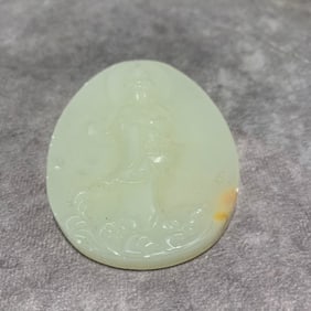 A FINE WHITE JADE GUANYIN PLAQUE