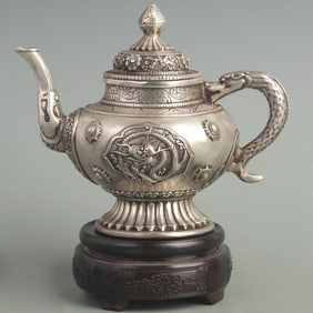 A FINE WHITE BRONZE DRAGON PATTERN TEAPOT