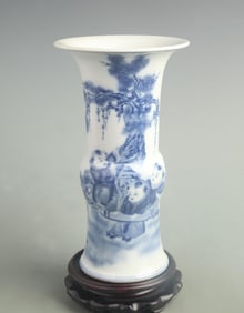 BLUE AND WHITE CHILD FIGURE PORCELAIN FLOWER VASE
