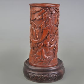 A FINELY CARVED FIGURATIVE BRUSH HOLDER