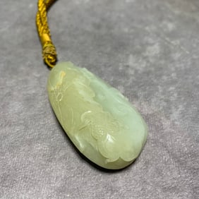 HETIAN GREENISH-WHITE JADE HAND PIECE WITH LOTUS DESIGN