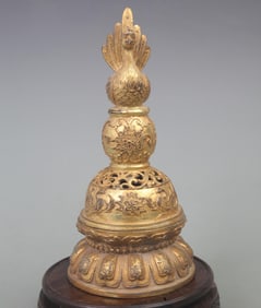 A BRONZE GILT PATTERNED PAGODA-STYLE INCENSE DIFFUSER