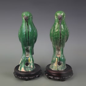 PAIR OF GREEN-GLAZED PORCELAIN PARROT FIGURINES