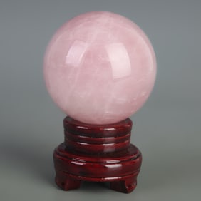 A FINE ROSE QUARTZ SPHERE WITH BASE