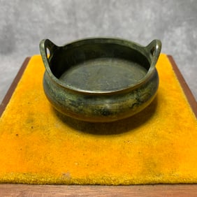 A FINE BRONZE THREE FOOT INCENSE BURNER WITH EAR HANDLES