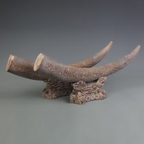 PAIR OF CLAY MADE CARVED HORN FIGURINES (WITH STANDS)