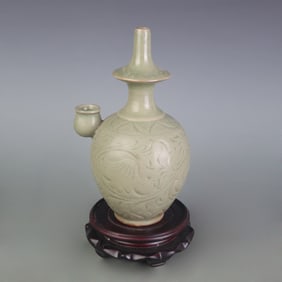 A FINE CARVED CELADON GLAZED TEAPOT