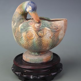 A FINE SANCAI GLAZED DUCK-SHAPED POTTERY BOWL