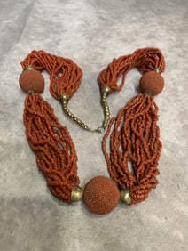 A FINE SMALL RED CORAL NECKLACE WITH PENDANT
