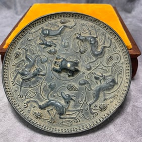 A FINELY CARVED SONG DYNASTY BRONZE MIRROR