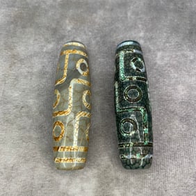 GROUP OF TWO TIBETIAN BUDDHIST DZI TIAN ZHU PENDANT