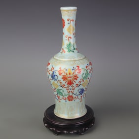 CELADON GLAZED VASE WITH PAINTED FLORAL RATTLING ORNAMENT