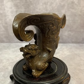 A FINE BRONZE WINE CUP IN DRAGON PATTERN