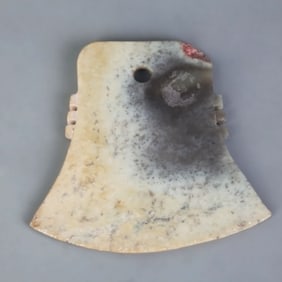 AN ANTIQUE JADE MADE AXE