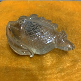 A SMALL GLASS MADE FISH FIGURE