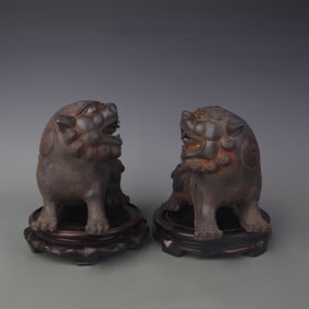 PAIR OF CAST IRON LION STATUES
