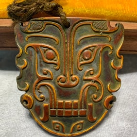 BONE MADE PENDANT WITH BEAST MASK PATTERN