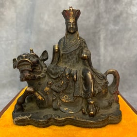 A FINE BRONZE GUAN YIN RIDING TIGER STATUE