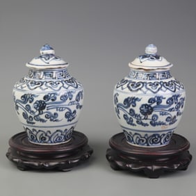 PAIR OF BLUE-AND-WHITE FLORAL PORCELAIN JARS
