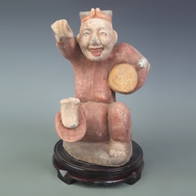 A FINE COLORED PAINTED POTTERY FIGURINE