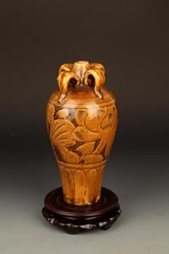 A BROWN COLOR GLAZED FLOWER CARVING PORCELAIN MEI BOTTLE