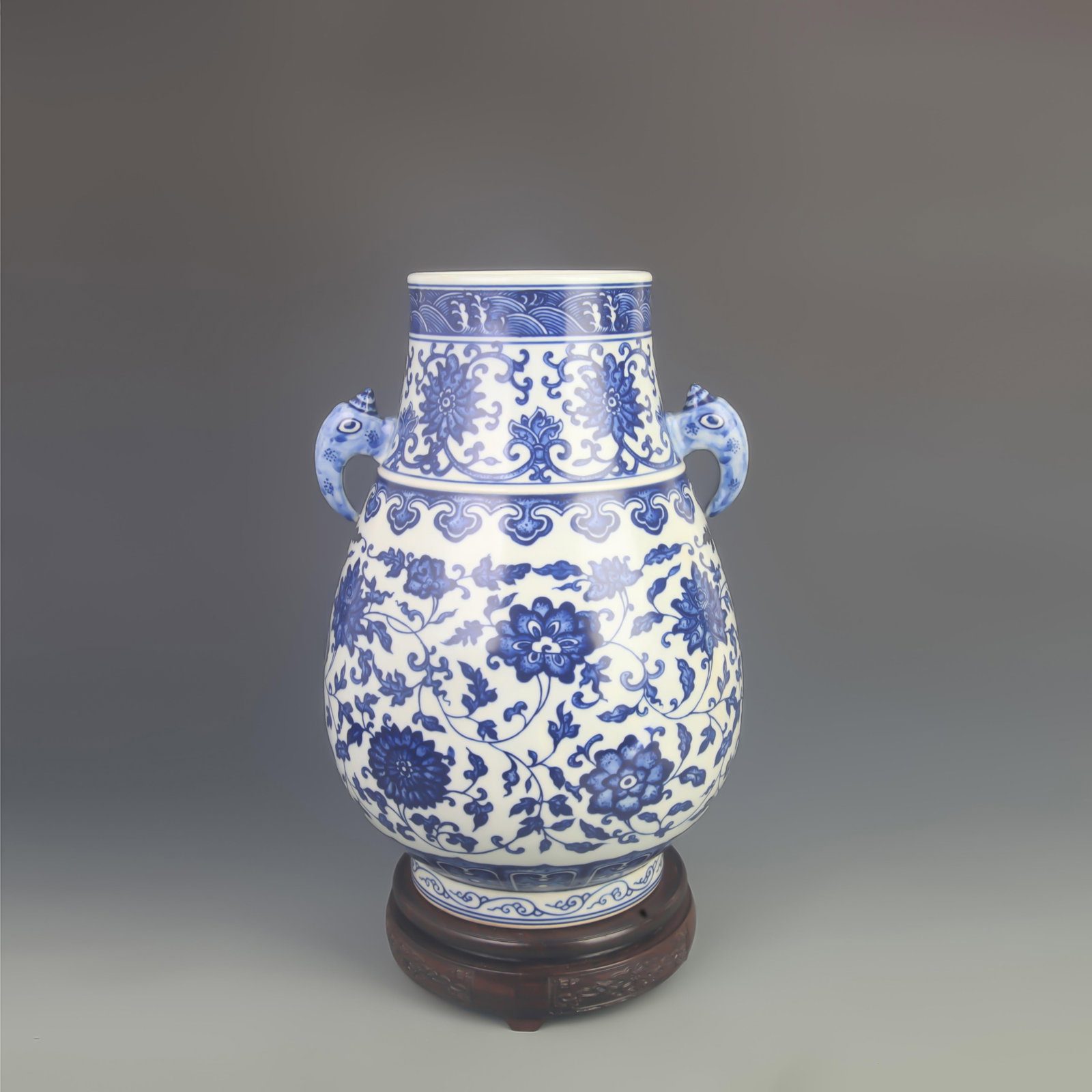 BLUE AND WHITE LOTUS PATTERN ELEPHANT HEAD ZUN VASE: Qing Dynasty Qian Long Period; High: 12.8 inch
