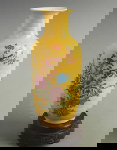 FAMILLE ROSE YELLOW GROUND MAGPIE PATTERN PLUM STYLE PORCELAIN VASE: Qing Dynasty Qian Long Period; High: 10.5 inch;Width: 4.50 inch