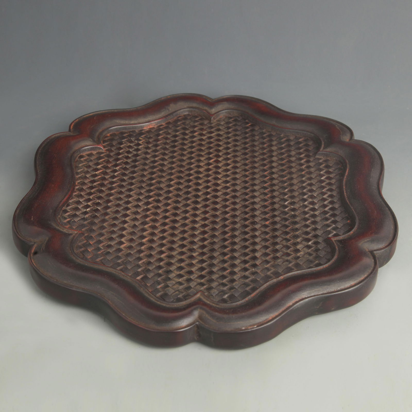 EBONY CARVED TEA COASTER WITH WOVEN SURFACE: 20th Century; High: 1.00 inch; Diameter: 13.0 inch;
