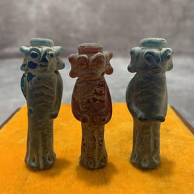 GROUP OF THREE SMALL GLASS HUMAN FIGURE