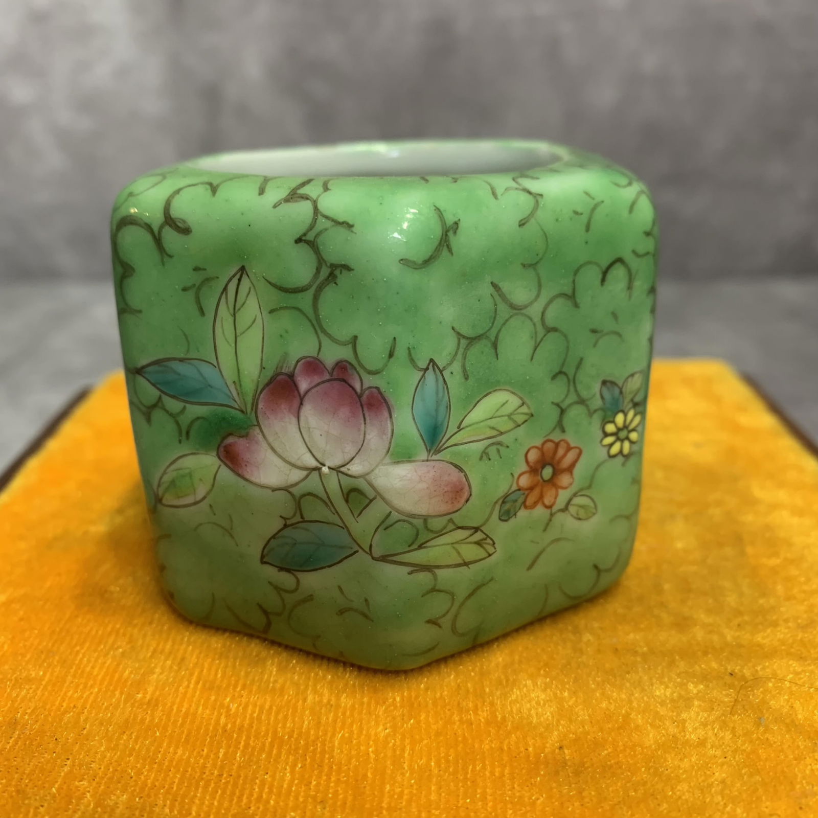 A SMALL FAMILLE ROSE SIX SIDE PORCELAIN WATER JAR: Qing Dynasty; High: 2.1 inch Diameter: 2.6 inch