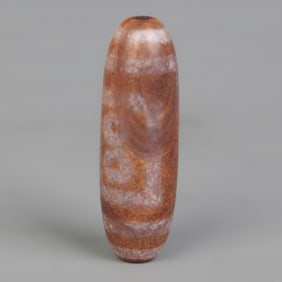 A FINE TIBETIAN BUDDHIST DZI BEAD