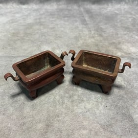PAIR OF BRONZE FOUR-LEGGED INCENSE BURNERS WITH RUYI HANDLES