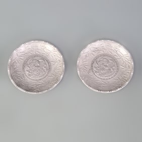 PAIR OF SILVER-PLATED SMALL PLATES