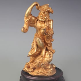 A FINE BRONZE LIU HAI PLAYING WITH THE GOLDEN TOAD FIGURINE