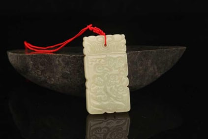 A FINE HETIAN BOY FIGURE JADE PENDANT