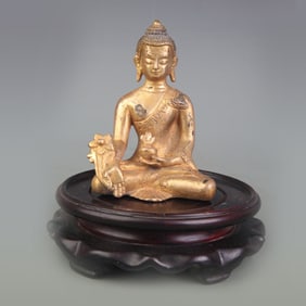 A SMALL BRONZE BHAISAJYAGURU (MEDICINE BUDDHA)