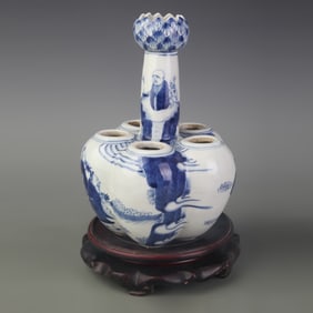 BLUE-AND-WHITE FIGURATIVE SIX-HOLE PORCELAIN BOTTLE