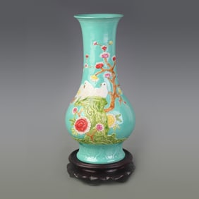 GREEN-GLAZED VASE WITH CARVED BIRD AND FLOWER PATTERNS