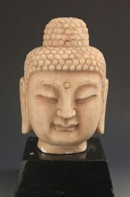 A LARGE STONE CARVED BUDDHA HEAD