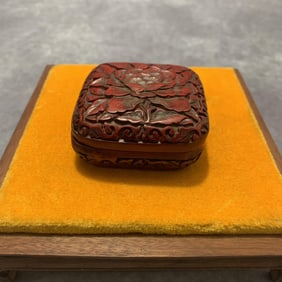 A FINE SMALL RED CARVED LACQUER BOX