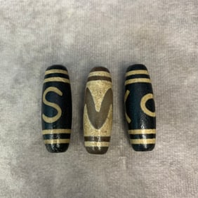 GROUP OF THREE SMALL TIBETIAN TIAN ZHU PENDANT