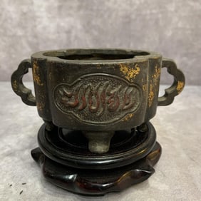 A FINELY CARVED BRONZE INCENSE BURNER WITH SANSKRIT