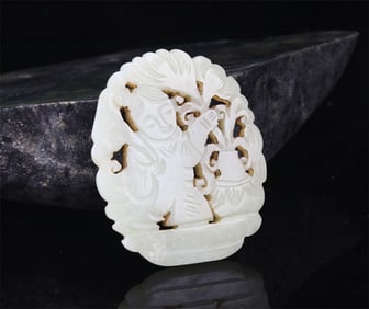A FINE HE TIAN JADE IN FIGURE OF BOY WITH LOTUS