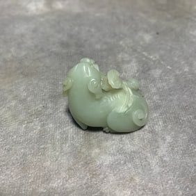 HETIAN GREENISH-WHITE JADE MYTHICAL BEAST HOLDING LINGZHI