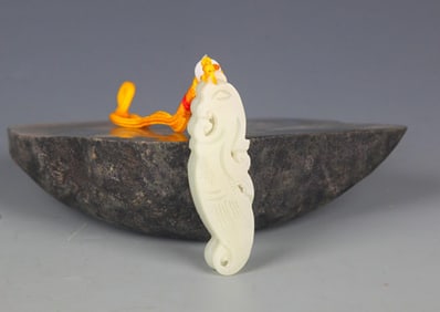 A FINELY CARVED HETIAN PALE CELADON JADE PENDANT PENDANT